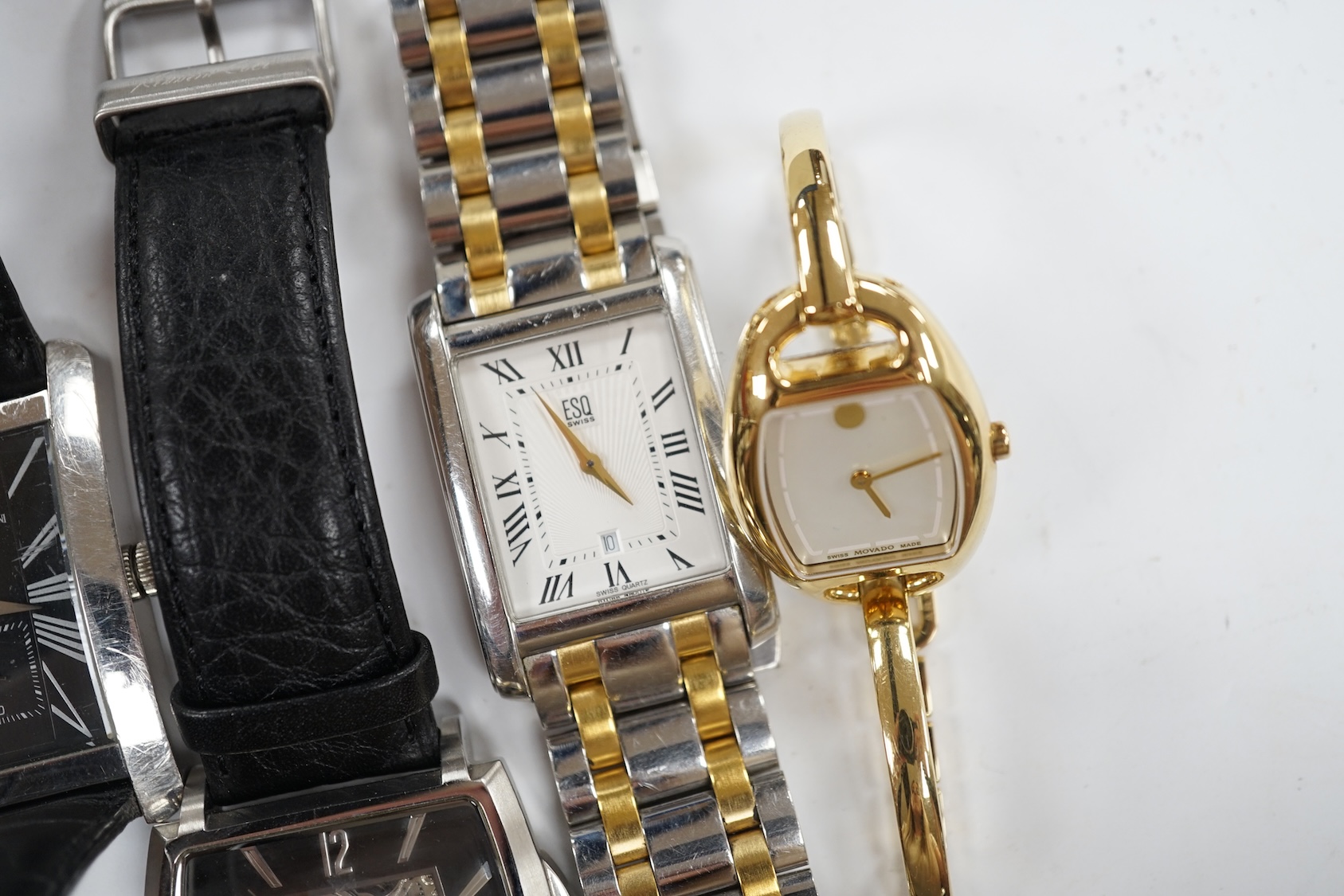 Eight assorted lady's and gentleman's modern wrist watches including Emporio Armani, Esq and Fossil. Condition - poor to fair